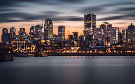 A skyline of a modern city in the evening