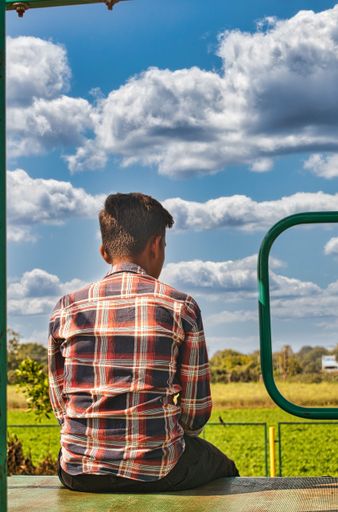A beautiful shot of a man from behind enjoying the nature