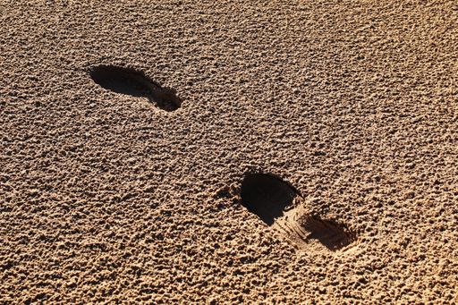 Footsteps in the sand, texture of sand