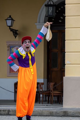 A vertical shot of a clown performing outdoors, Matanzas, Cuba