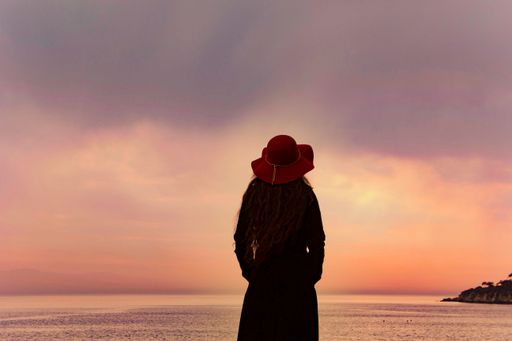 A woman looking towards the sunset view heybeliada Istanbul, turkey