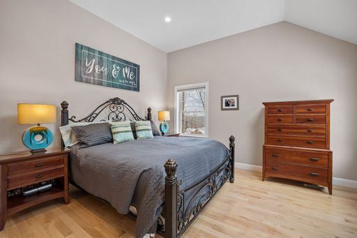 A modern designed bedroom with cozy furniture