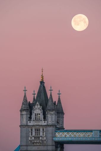 London Tower Bridge with Full Moon and pink sunrise sky