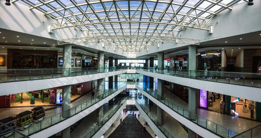 An interior of a shopping mall with a glass ceiling in Chandigarh, India