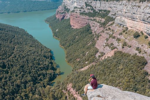 A young male enjoying the mesmerizing scenery of the Morro de la Abeja in Tavertet, Catalonia, Spain