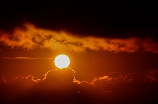 A scenic view of the sunset over a field