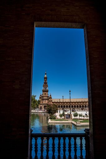 A vertical shot of the North tower of Plaza de Espana seen from afar