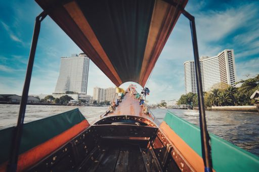 point of view of long tail boat on Chao Phraya river in Bangkok, Thailand