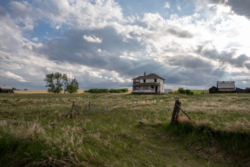 Facade of an old farm house on the prairies of Alberta, Canada.
