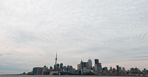 A low angle shot of Toronto cityscape, Canada under a cloudy sky