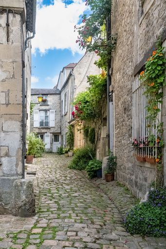 Senlis, medieval city in France, typical street with ancient houses