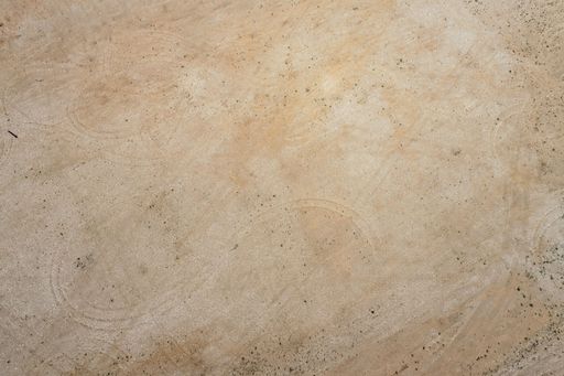 An aerial view of a land with beige soil