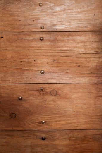 A vertical closeup shot of a wooden wall - great for background or a blog