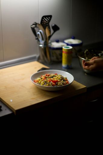 A vertical shot of a delicious quinoa salad on a kitchen counter