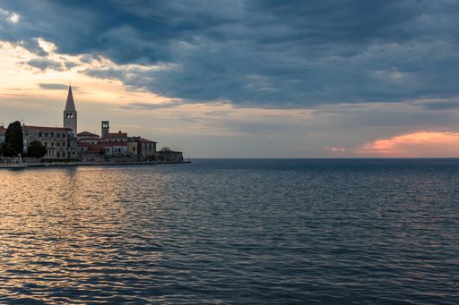 The beautiful view of a cloudy sky over the coast of the Adriatic sea in Porec, Croatia