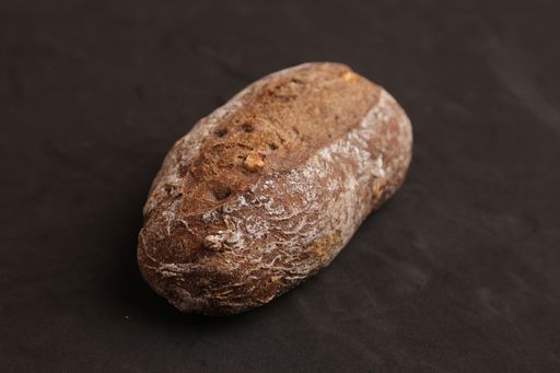 A high angle shot of homemade bread isolated on a black surface