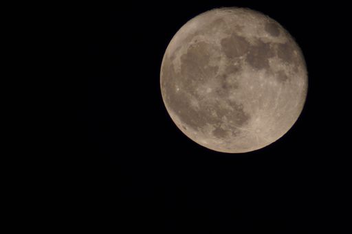 A beautiful shot of the bright full moon in night sky