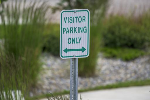 A selective focus shot of a parking sign