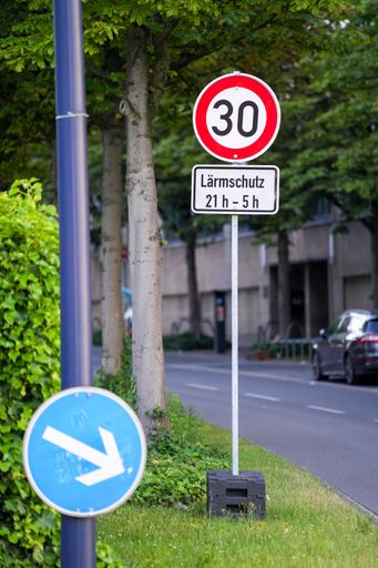A vertical shot of 30 speed limit sign
