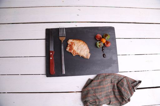 A top view shot of pork tenderloin steak on a smooth surface
