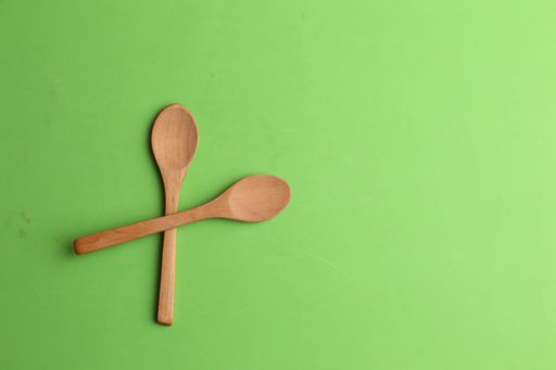 A closeup shot of small bamboo wooden kitchen spoons for food