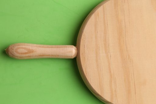 A closeup shot of a kitchen board for cutting sausage and meat