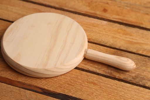 A closeup shot of a chopping board on a wooden surface