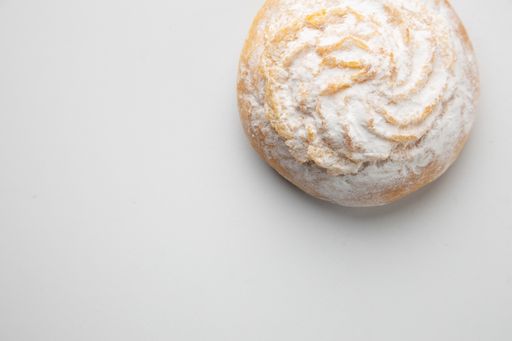 A delicious cookie with coconut powder on whitebackground