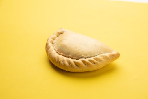 A closeup shot of homemade delicious dumpling on a yellow background
