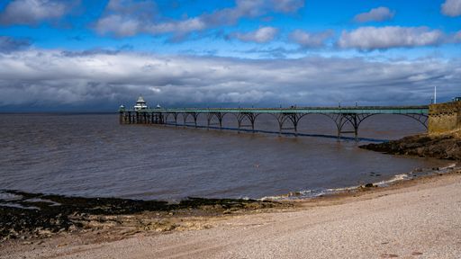 The view of Clevedon Pier against the blue cloudy sky. Somerset, England.
