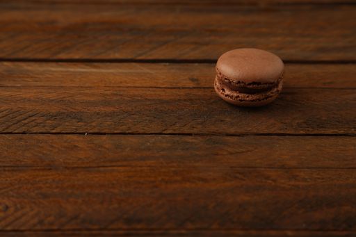 A closeup shot of a sweet brown macaroon cookie
