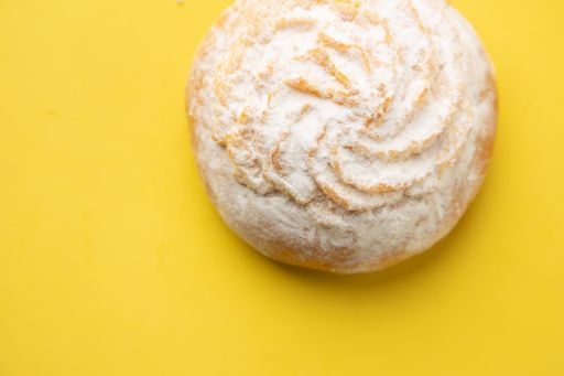 An overhead shot of an appetizing cake isolated on a yellow background