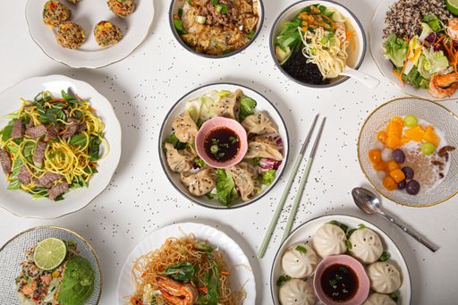 A top view of the traditional delicious Asian food dishes served on the table