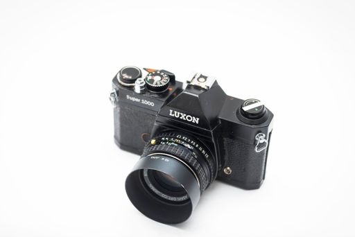 An Old Luxon Super 1000 digital camera on a white background