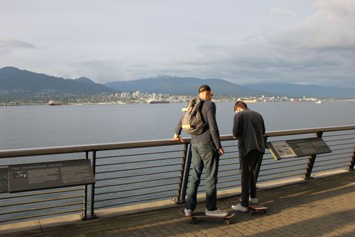The Young people with skateboards in downtown Vancouver, British Columbia, Canada