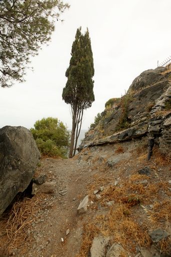 A secret pathway at the seashore with bumpy corners in Spain, Almunecar, cliff San Cristobal