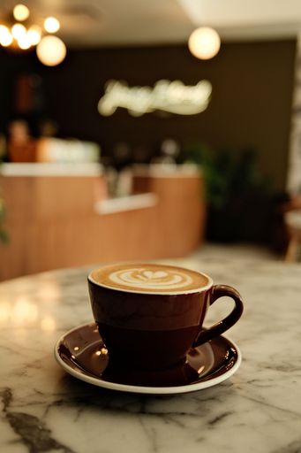 A vertical shot of a cup of cappuccino