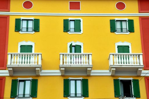View of a building with bright colors in a main street of Milan, Italy