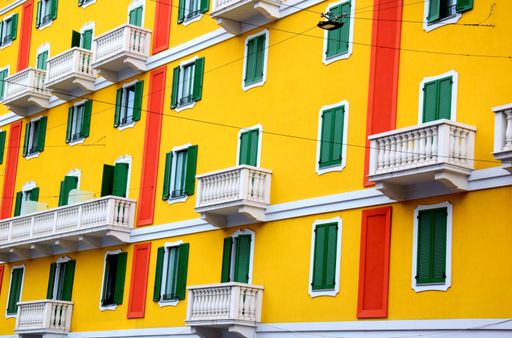 View of a building with bright colors in a main street of Milan, Italy