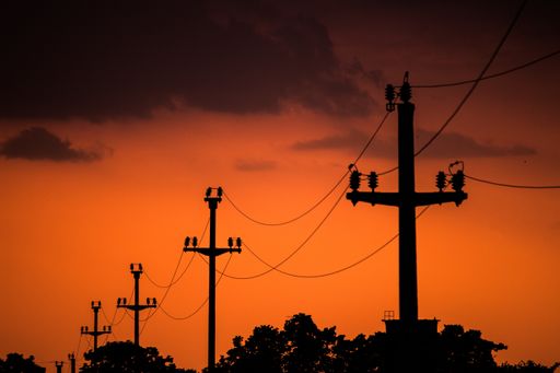 A shot of electric wires connecting with each other during evening time