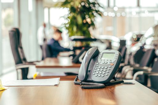 A black telephone in the office