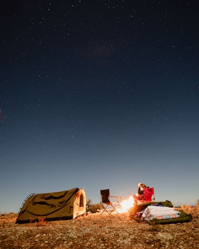 two campers in a starry night in outback south australia