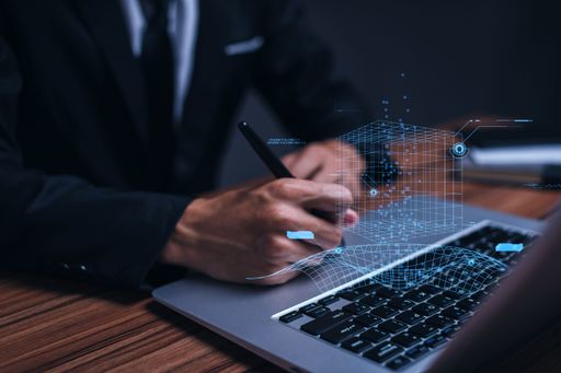 A successful businessman working on his laptop - metaverse digital cyber world technology concept