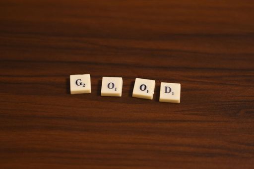 Selective focused close up shot of Good word. Made by using the letters in blocks in a wooden background.