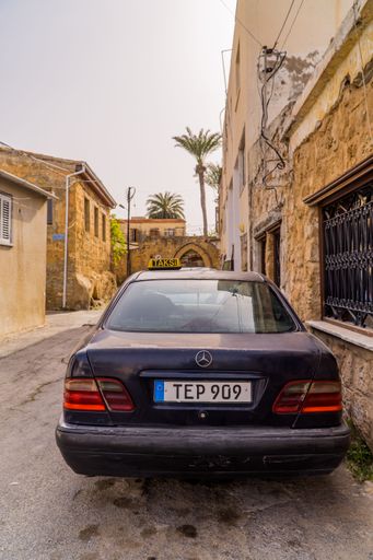 A vertical shot of a Mercedes taxi in the walled city, Famagusta