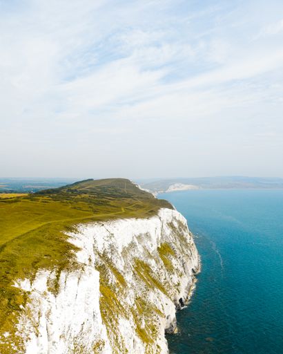 A vertical high angle shot of the Isle of Wight in the United Kingdom  under the light blue sky