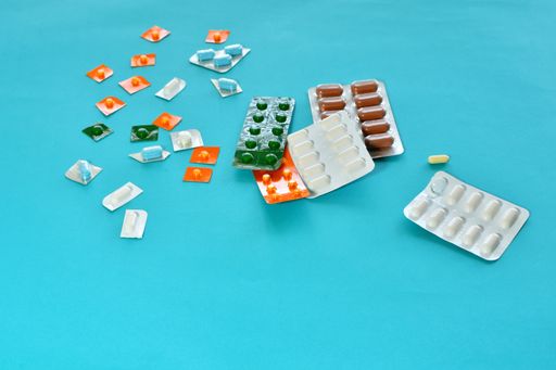 A closeup shot of different medicines on blue background