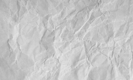 Creased paper background texture. Gray color. Full frame