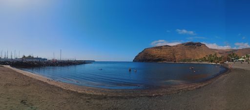 Magical seascape with coastal volcanic hills and blue wavy water in  La Gomera, Canary Islands, Spain.