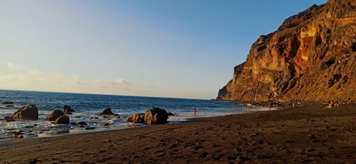 Magical seascape with volcanic hills and blue wavy water in San Sebastian de la Gomera, Canary Islands, Spain.